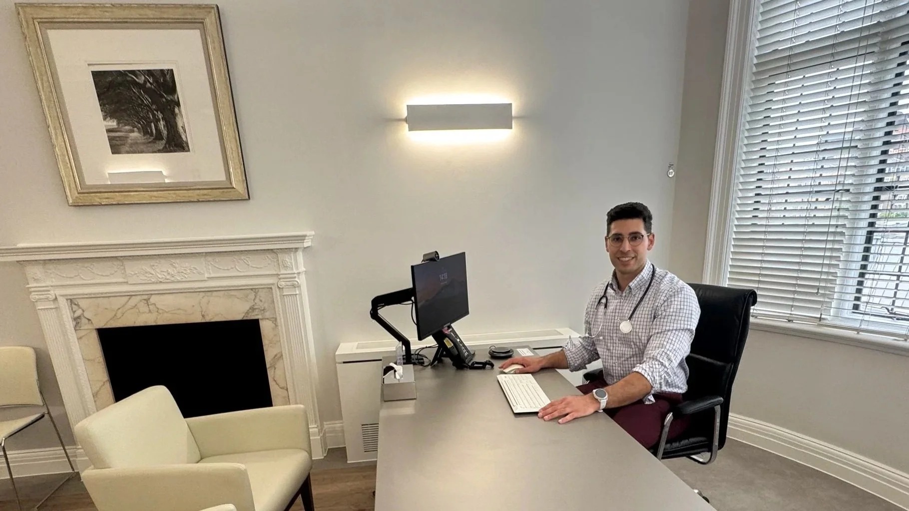Dr Tamir Malley at his desk